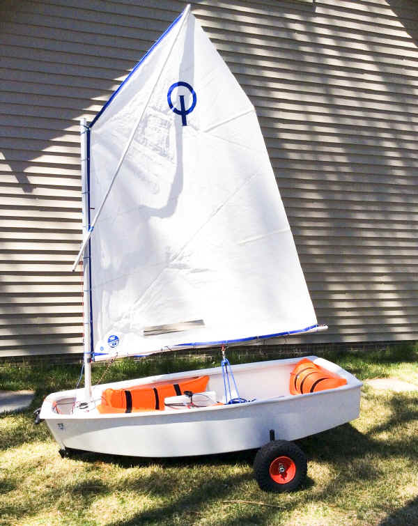 Dynamic Dolly for the Optimist Sailboat.  Made of lightweight aluminum, it makes launching an Opti Sailboat easy.  The wheels on this dolly are 16